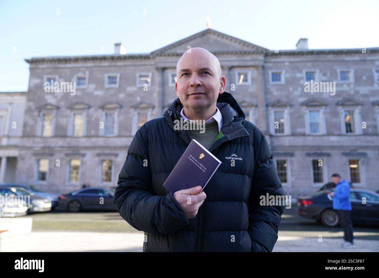 People Before Profit politician Paul Murphy holding a copy of the ...