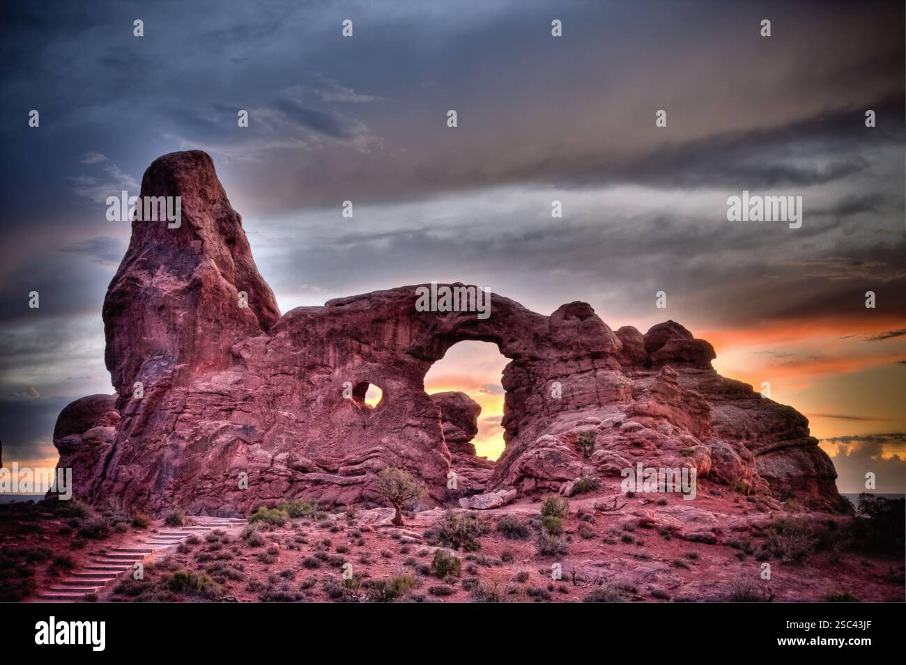 A large rock formation with a hole in the middle. The hole is ...