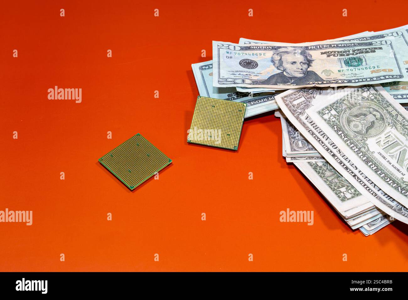 Microchips next to many dollars on