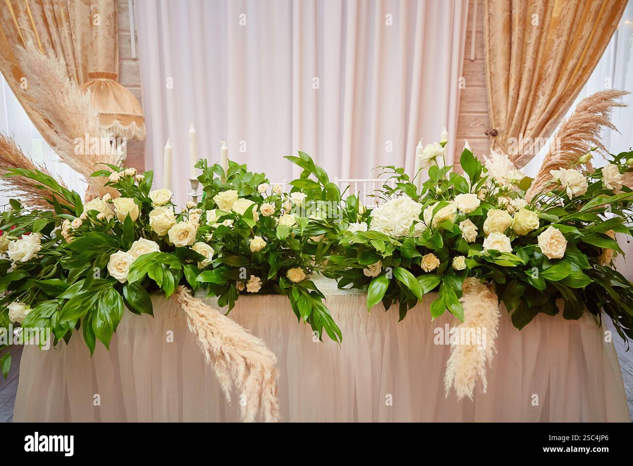 Wedding table setting in rustic style. decorated flowers Stock Photo