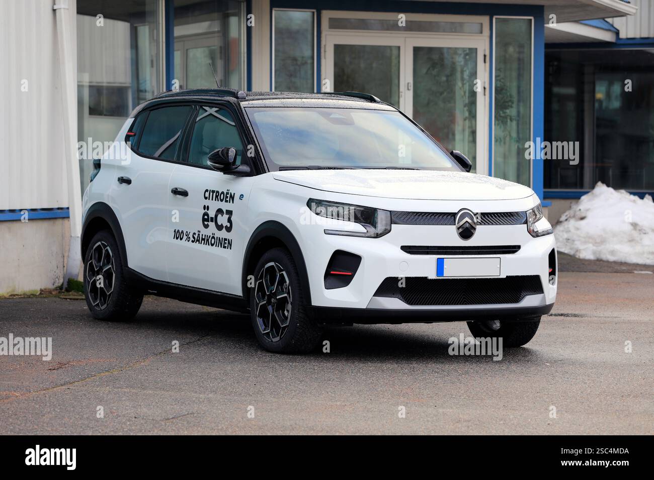 New, white Citroën ë-C3 battery electric car parked at the vehicle dealership. Salo, Finland. January 26, 2025. Stock Photo