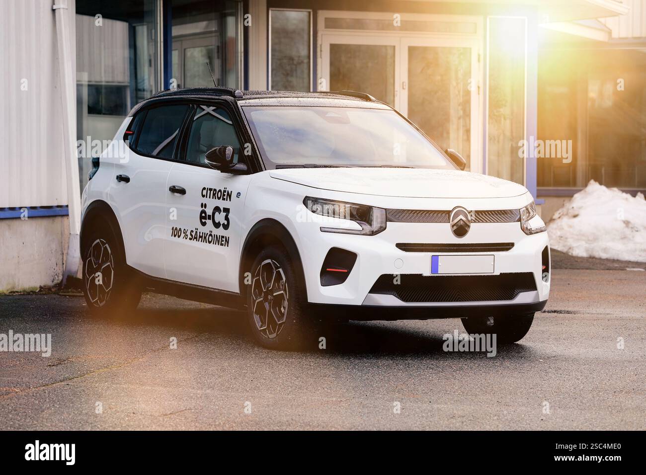 New, white Citroën ë-C3 battery electric car parked at the vehicle dealership. Salo, Finland. January 26, 2025. Stock Photo