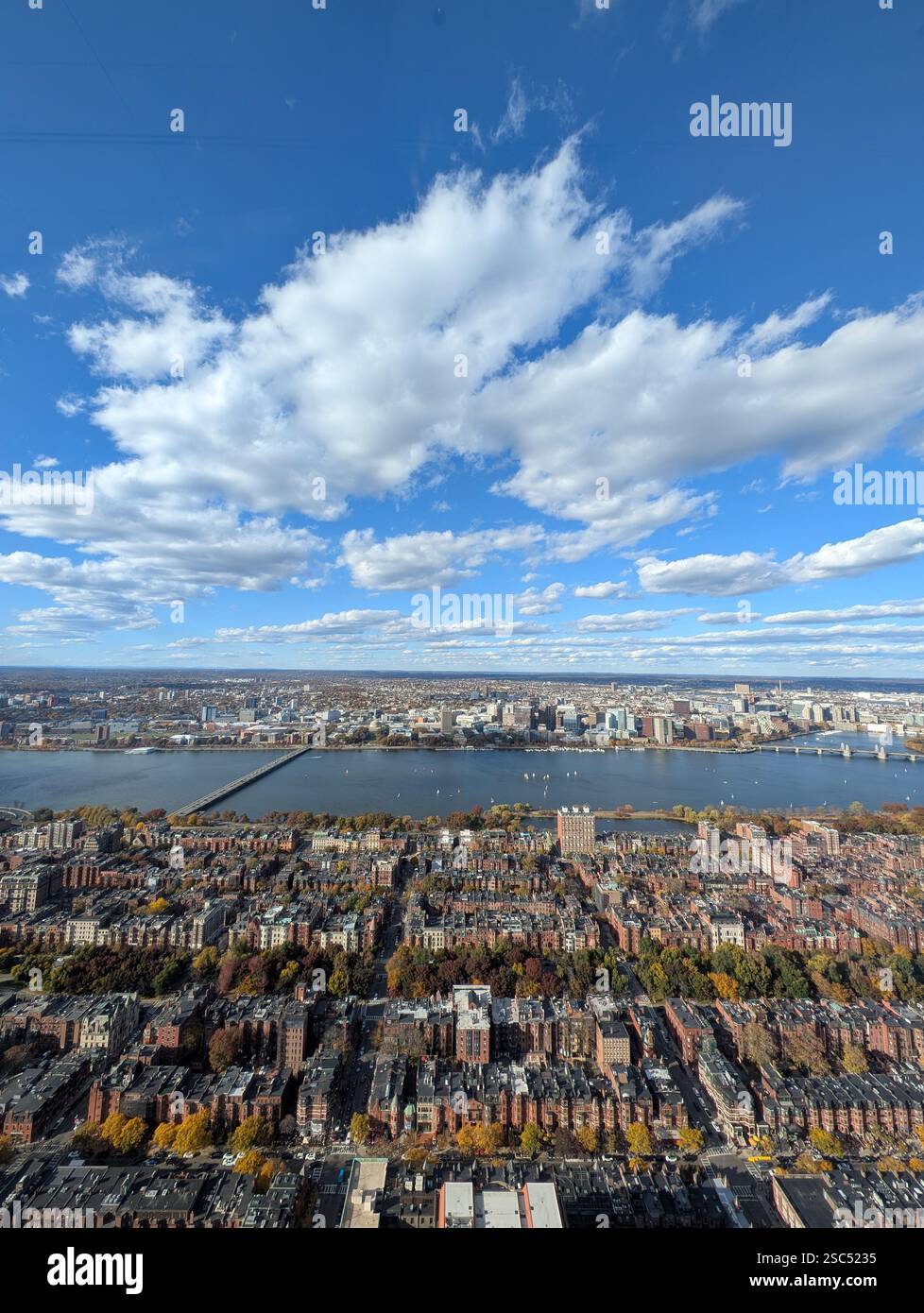 Elevated view of Boston and the Charles River, showing houses and infrastructure of the cityscape. - Smartphone Captured Stock Image