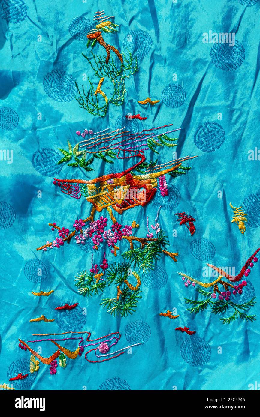 Embroidery detail on back of Golden Bee vintage Chinese Embroidered Kimono Robe made in China Stock Photo