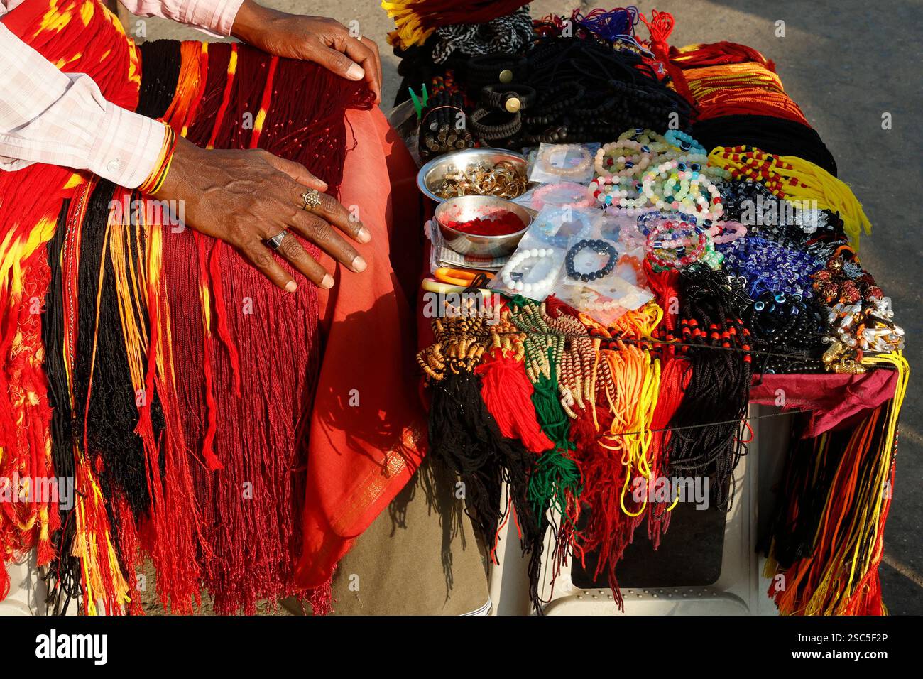 Religious beads and threads for sale at a street stall outside the ...