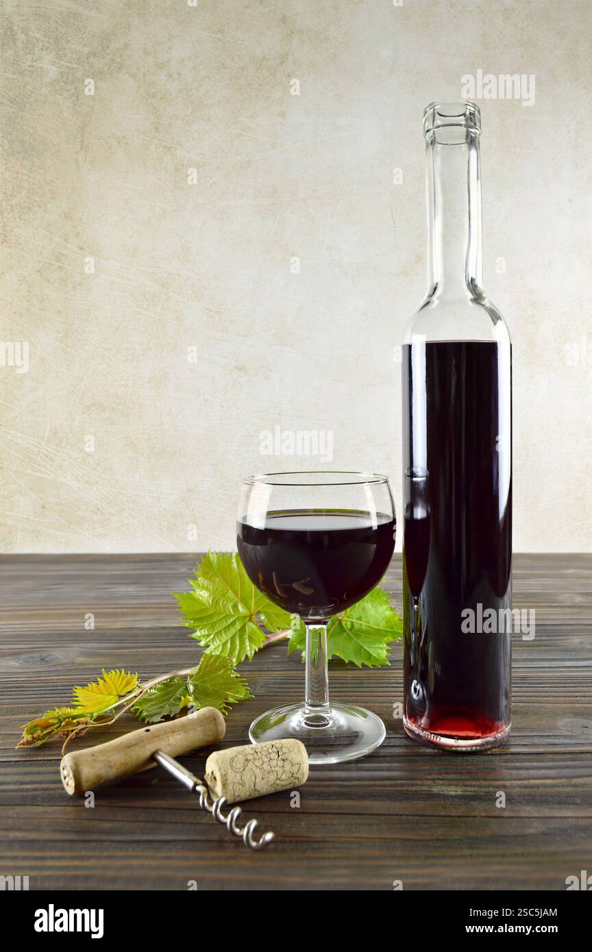 Red wine on wooden background, vertical image Stock Photo