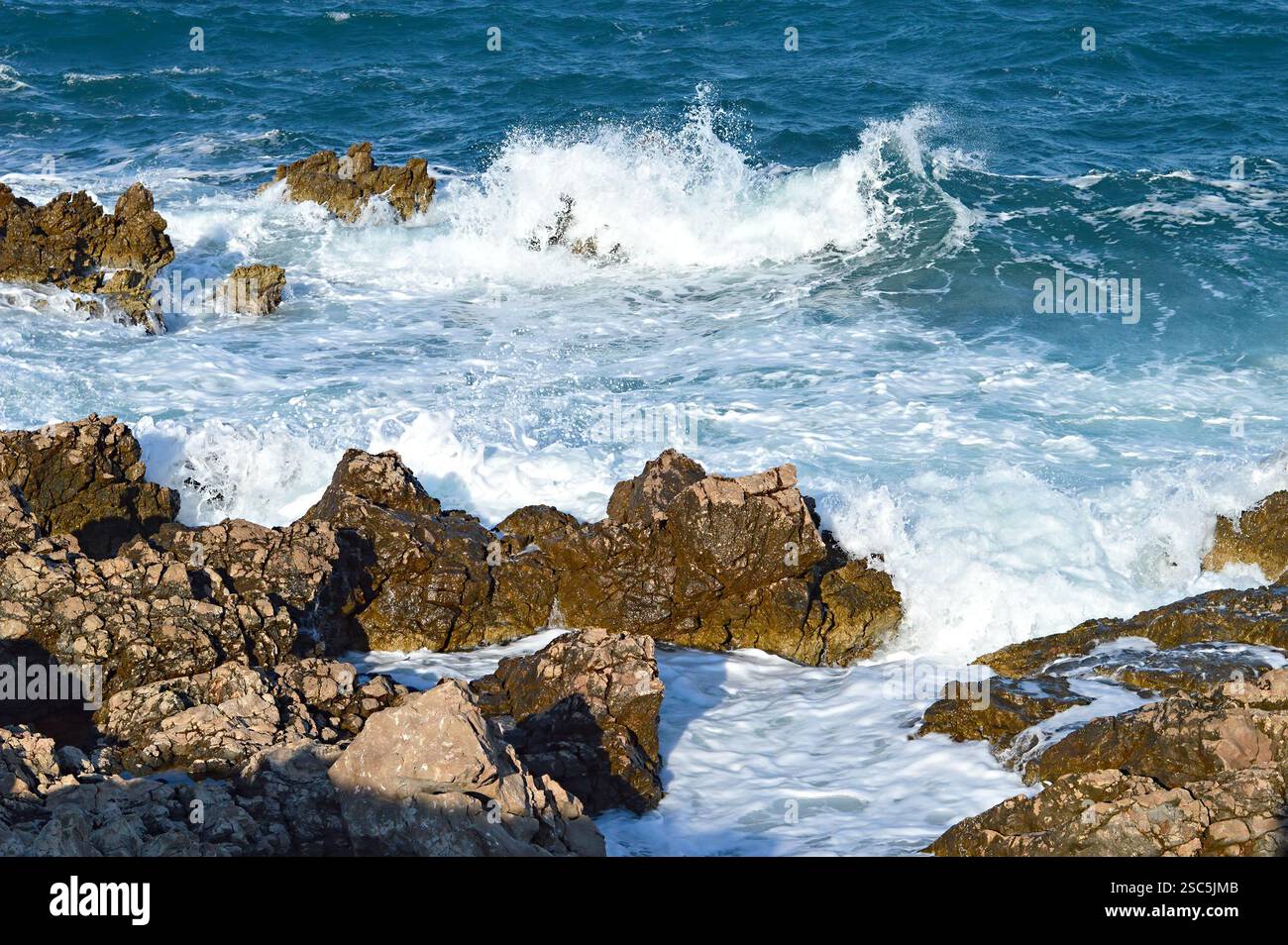 Sea wave splashing on the rock Stock Photo - Alamy