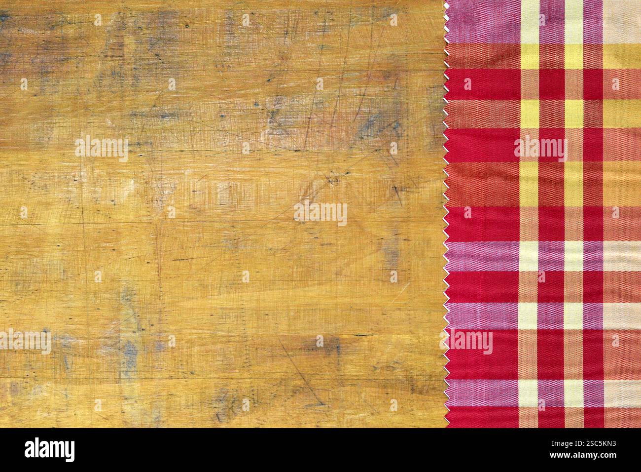 Checkered tablecloth on wooden table Stock Photo