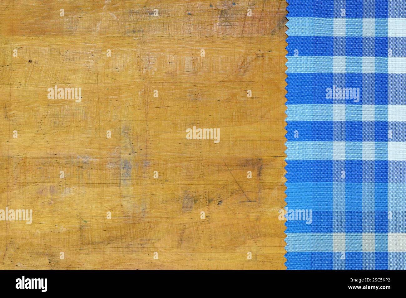 Blue checkered tablecloth on wooden background Stock Photo