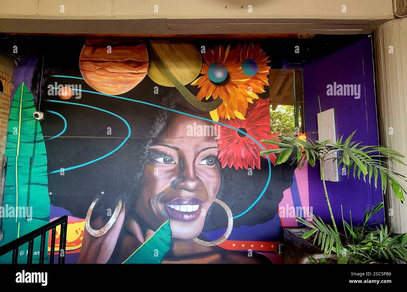 Barrio Getsemani Cartagena Colombia by Night - Street Art Mural - Afro Woman 3 / Mural de arte callejero: mujer con cabello afro - Smartphone Captured Stock Image