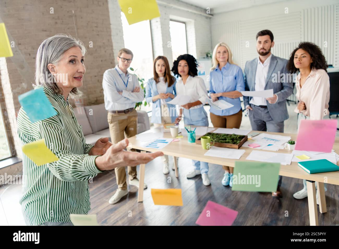 Professional team brainstorming and collaborating in a modern office ...