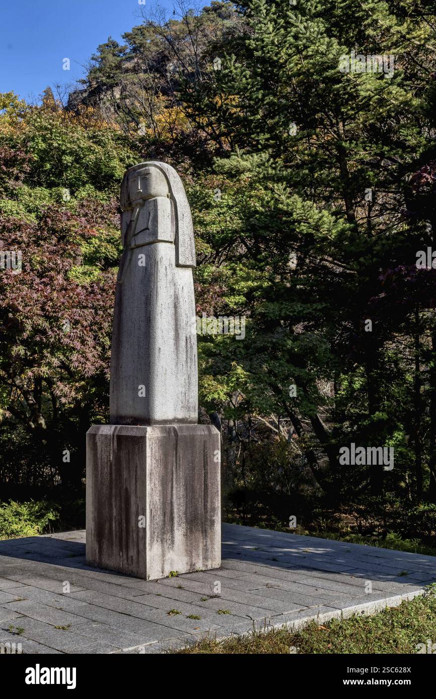 Gongju, South Korea, October 23, 2020: For editorial use only. Stone carved statue on plinth in mountainside woodland park. Artist unknown, Asia Stock Photo
