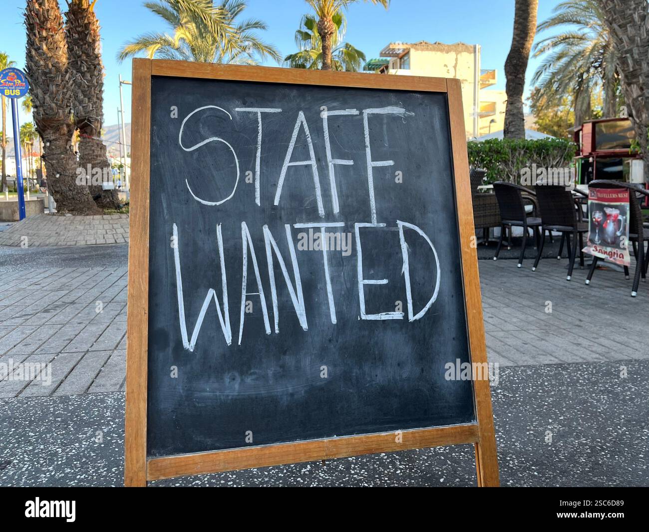 Staff Wanted Sign outside a British Pub called The Travellers Rest. Playa de las Américas, Arona, Tenerife, Canary Islands, Spain. 15th January 2025. - Smartphone Captured Stock Image
