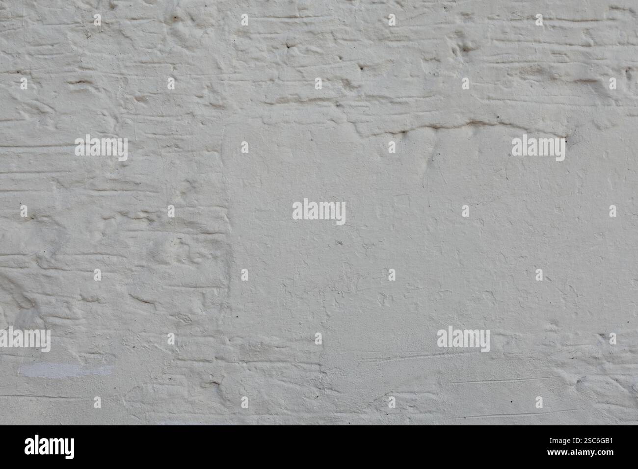 White brick wall weathered background texture with copyspace. Stock Photo