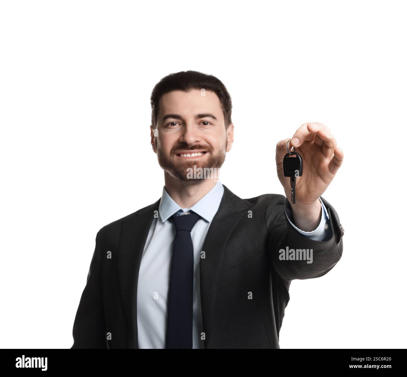 Cheerful salesman with car key on white background Stock Photo - Alamy