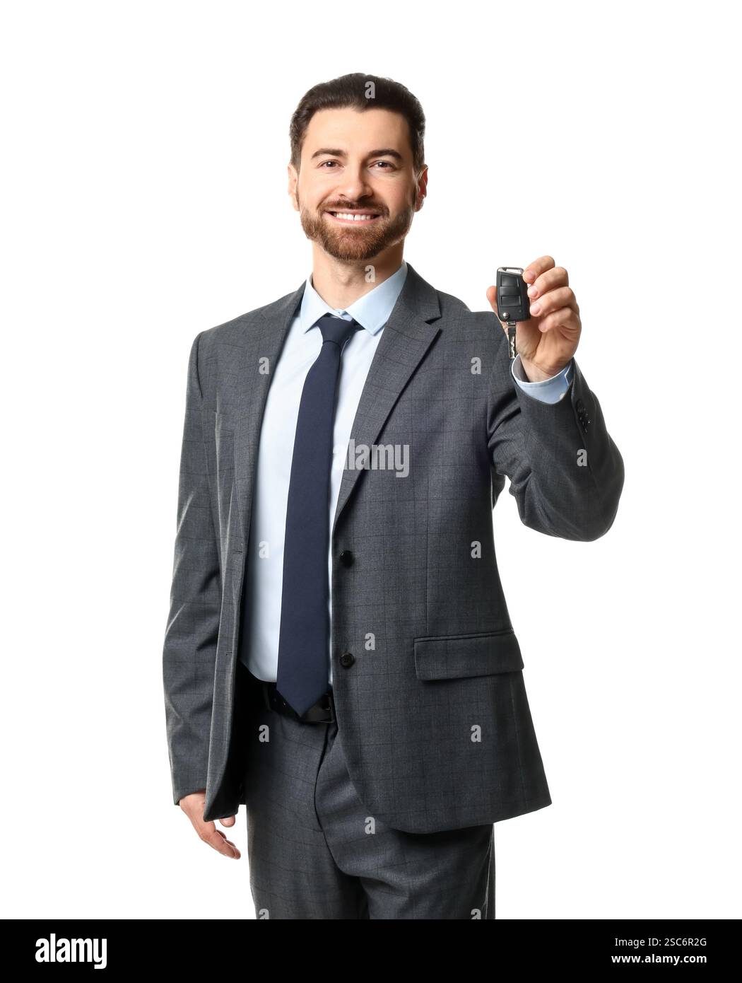 Cheerful salesman with car key on white background Stock Photo - Alamy