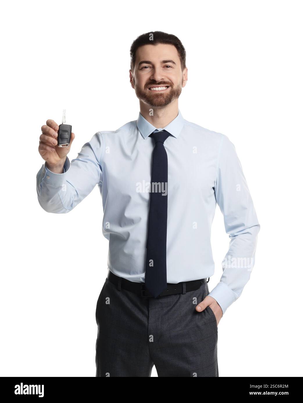 Cheerful salesman with car key on white background Stock Photo - Alamy
