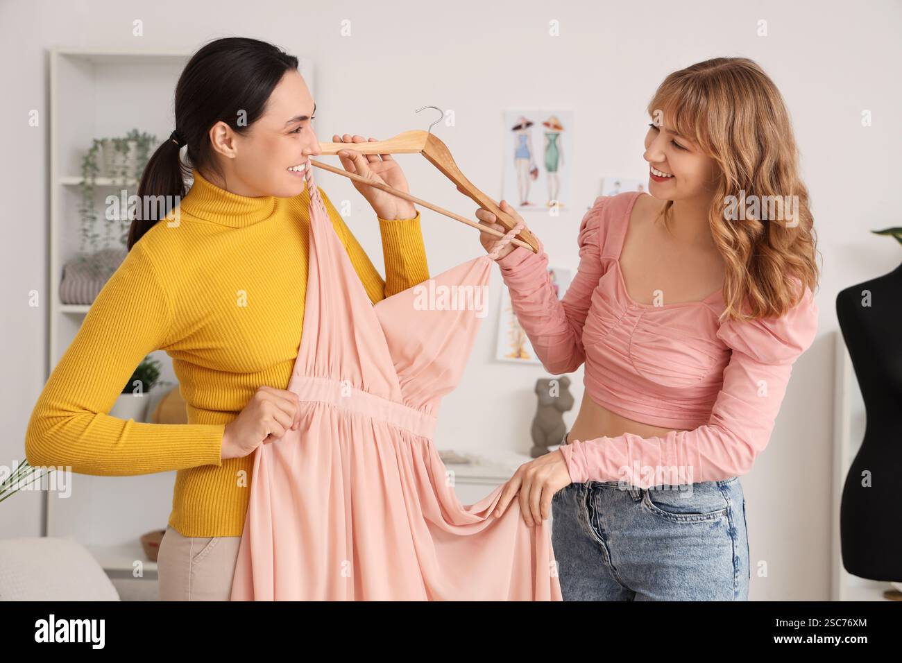 Female tailor and client with dress in atelier Stock Photo - Alamy