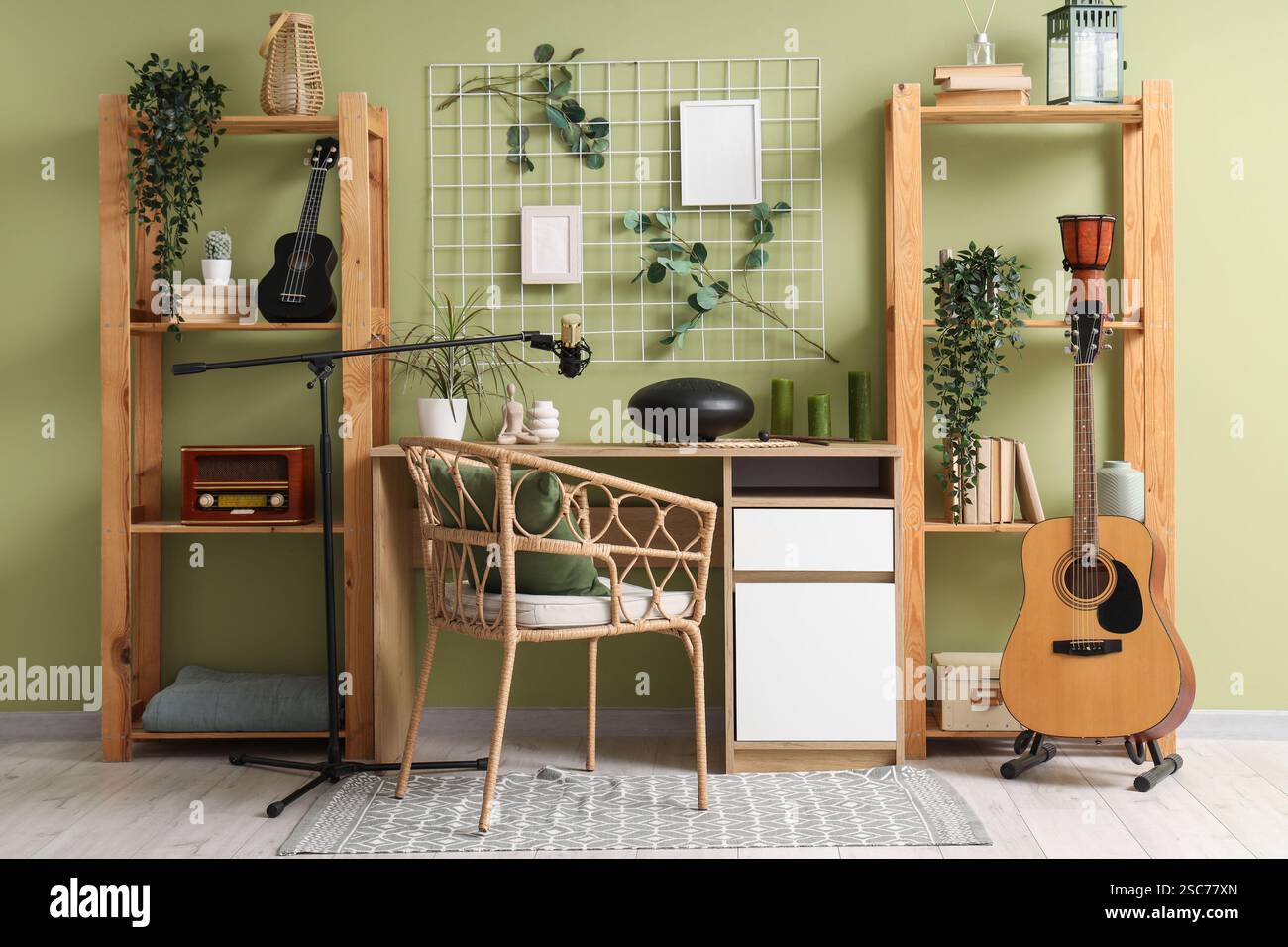 Interior of studio with workplace, shelf units and musical instruments ...