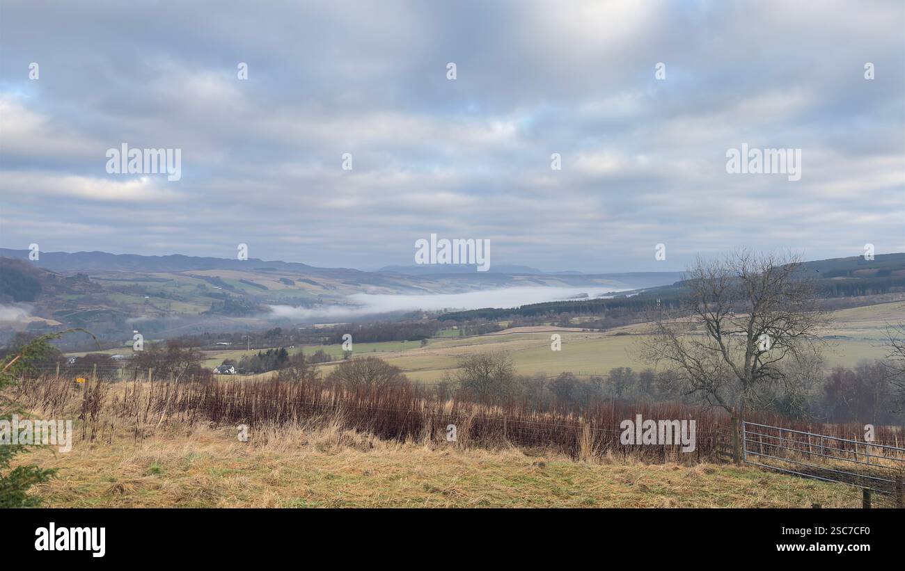 Panoramic view of the River Tay valley in Perthshire, Scotland on an overcast day with fog and mist. Open Scottish landscape in the Highlands - Smartphone Captured Stock Image