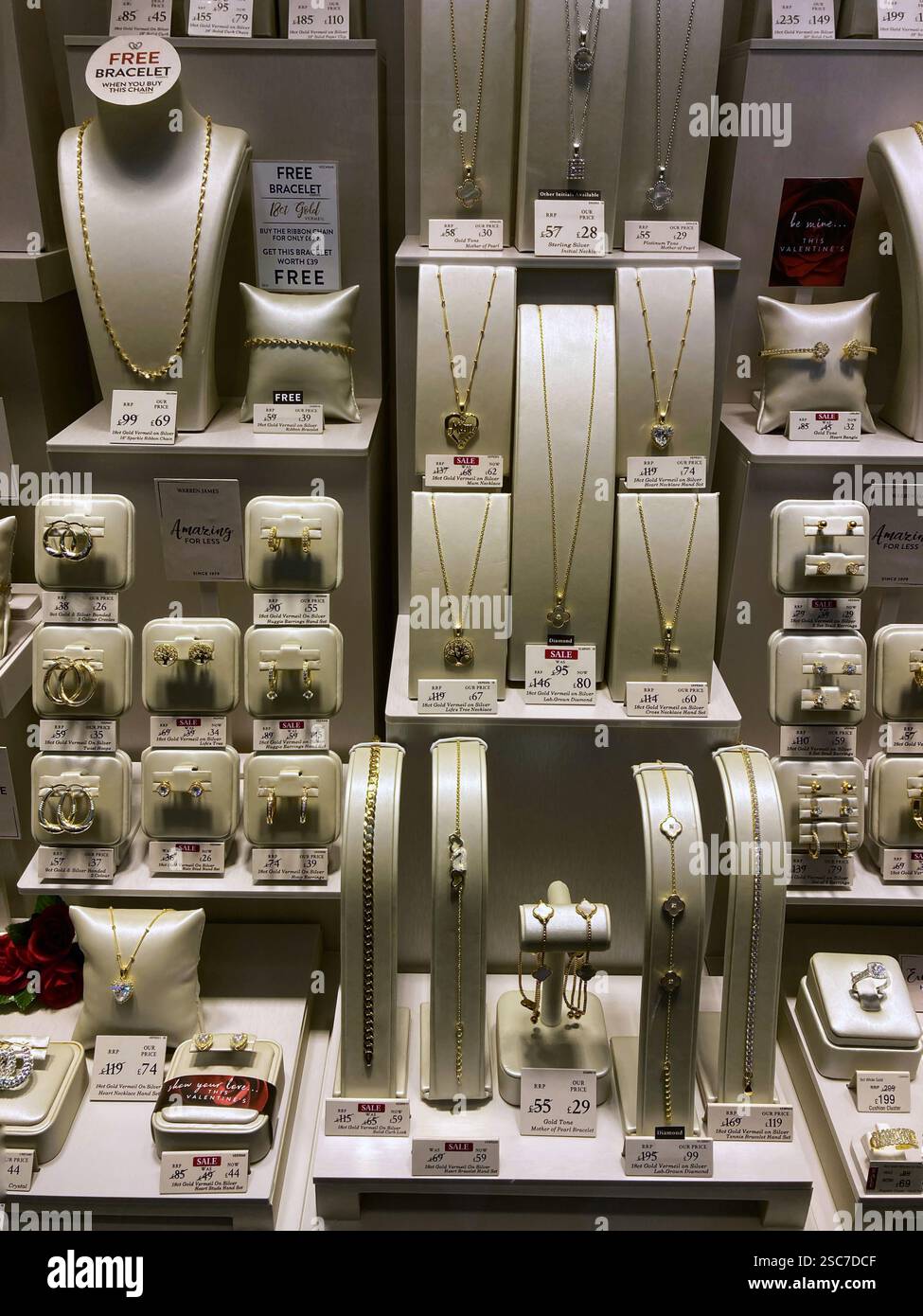Jewellers shop window with gold and silver items for sale - Smartphone Captured Stock Image Jewellers shop window with gold and silver items for sale - Smartphone Captured Stock Image