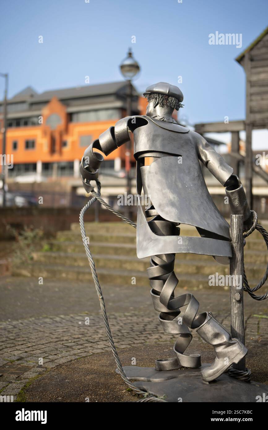 Metal sculpture of a dockworker, Liverpool, UK, near the Royal Albert ...