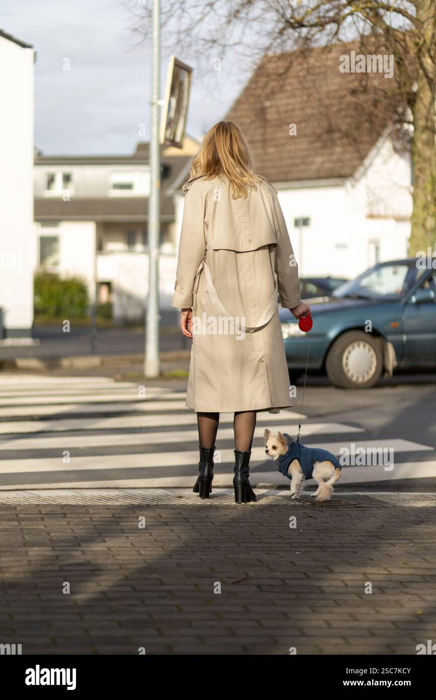 Person wearing long beige coat hi-res stock photography and images - Alamy