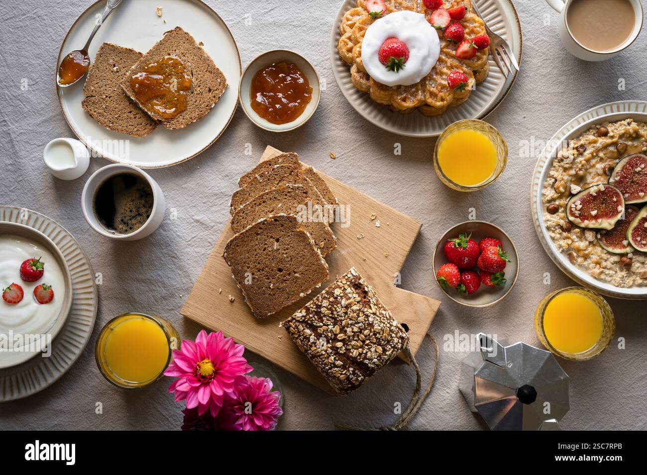 Set breakfast table with grain bread, waffles and porridge Stock Photo ...