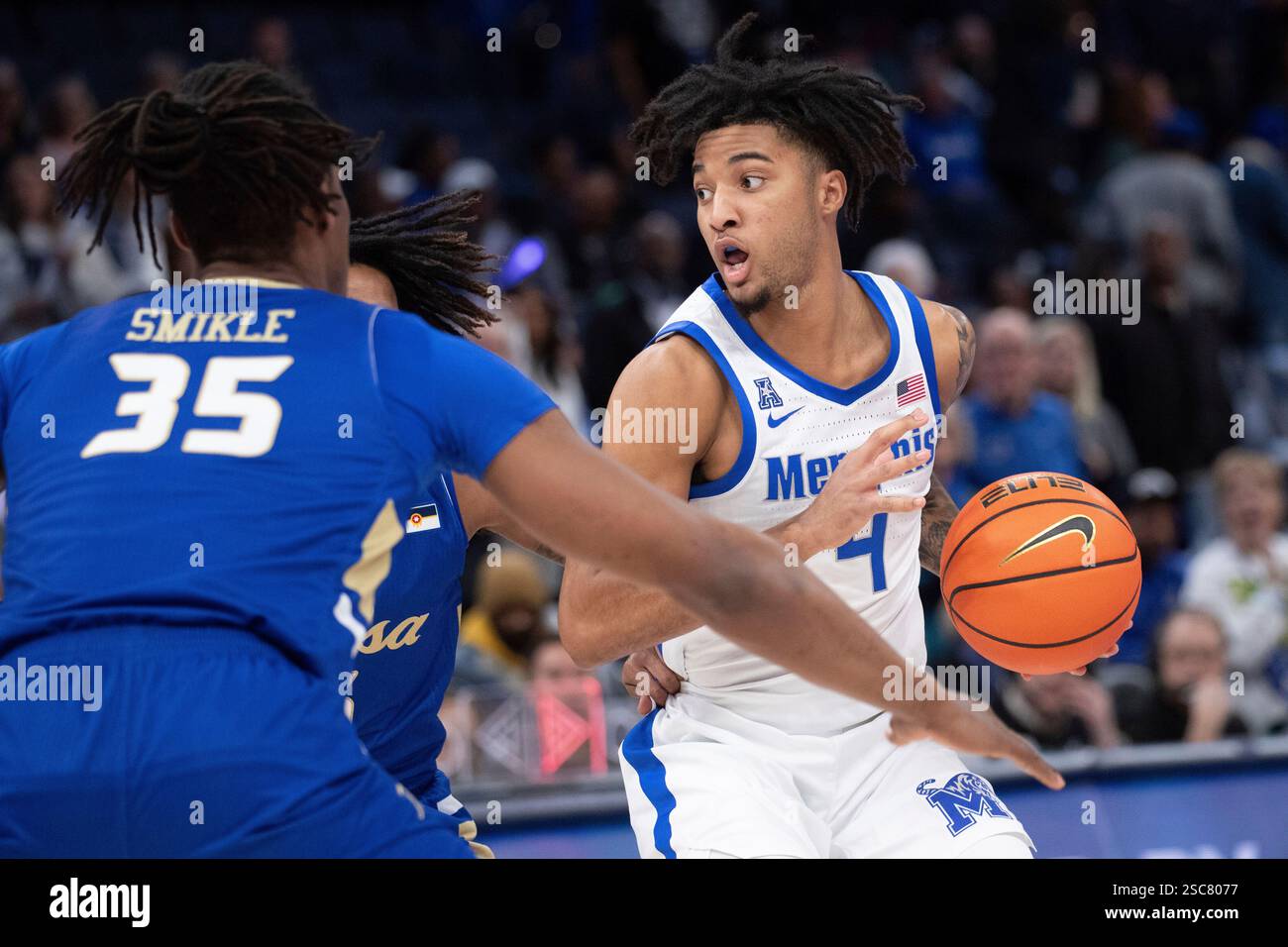 Tulsa forward Ian Smikle (35) and Tulsa guard Jesaiah McWright, center ...