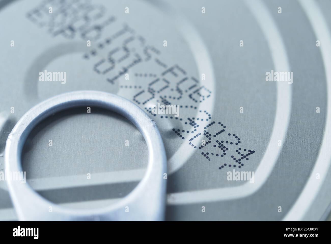 expire date on food can on white background Stock Photo - Alamy
