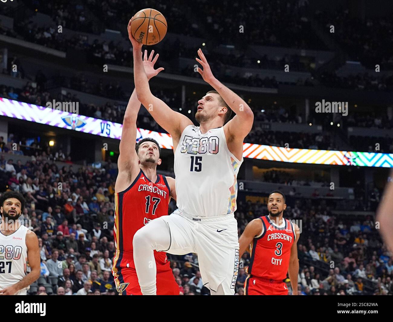 Matkovic Nba Denver Nuggets center Nikola Jokic, front, drives to the basket as New ...