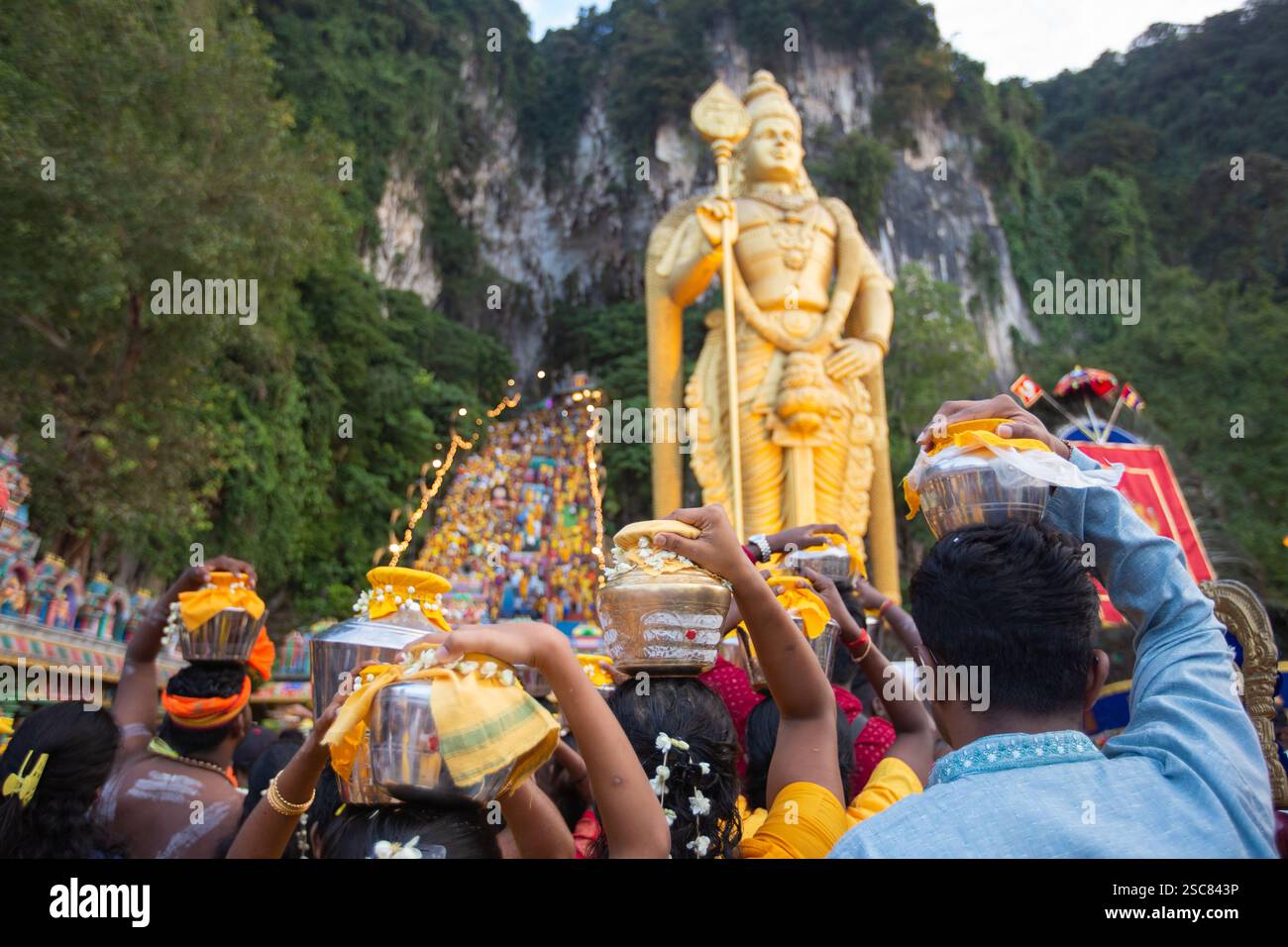 Hindu devotees walking up stairs at Thaipusam Festival Batu Caves