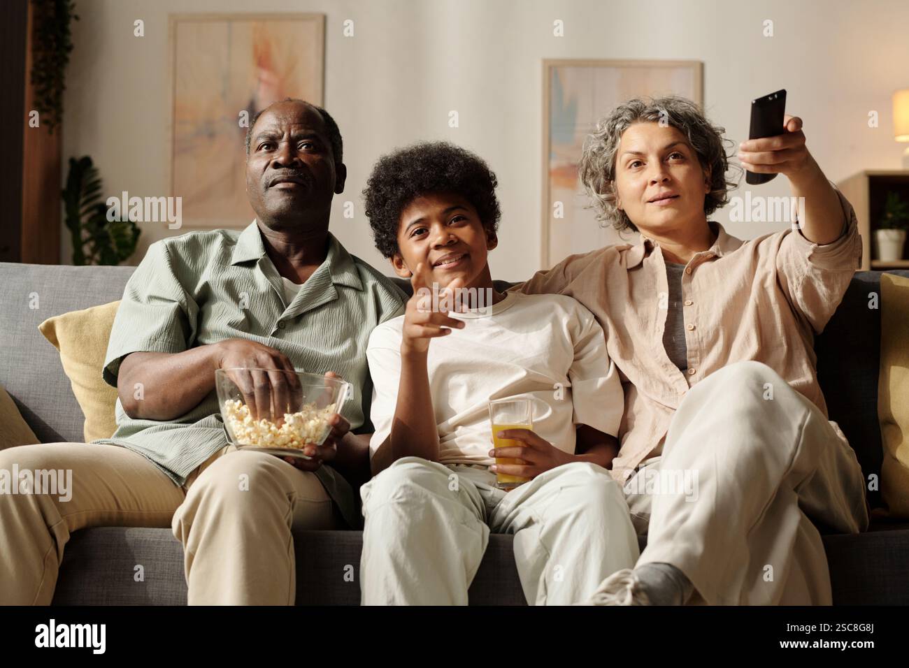African american happy family watching hi-res stock photography and ...