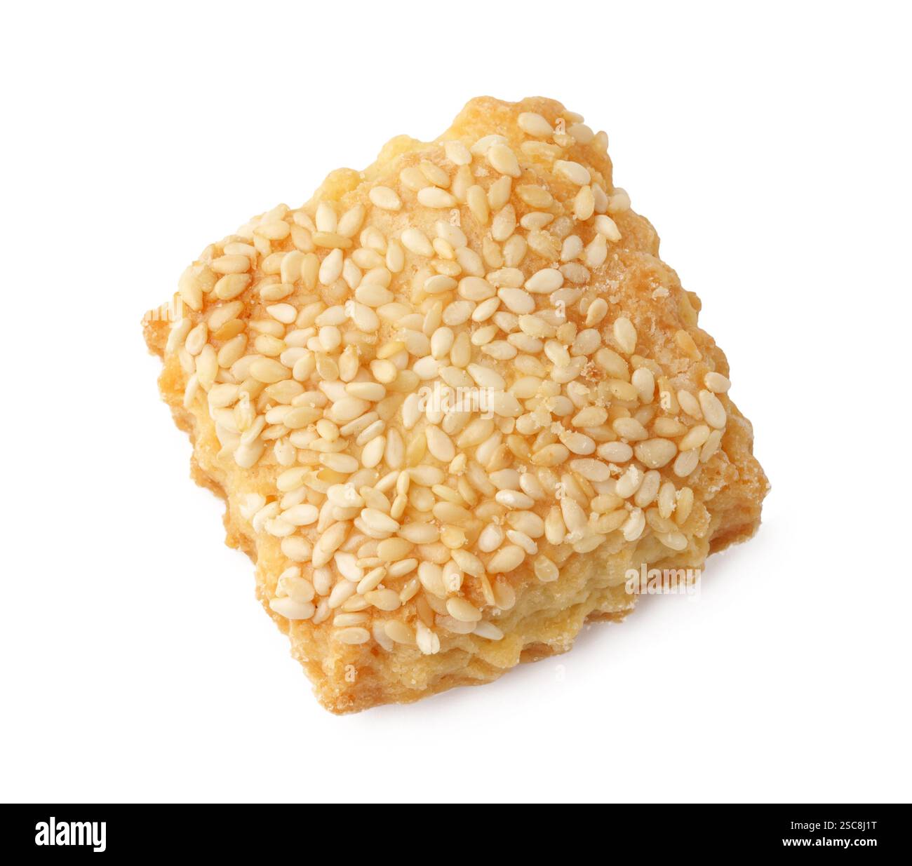 Baked sesame snack with crunchy texture and golden color on a white background Stock Photo