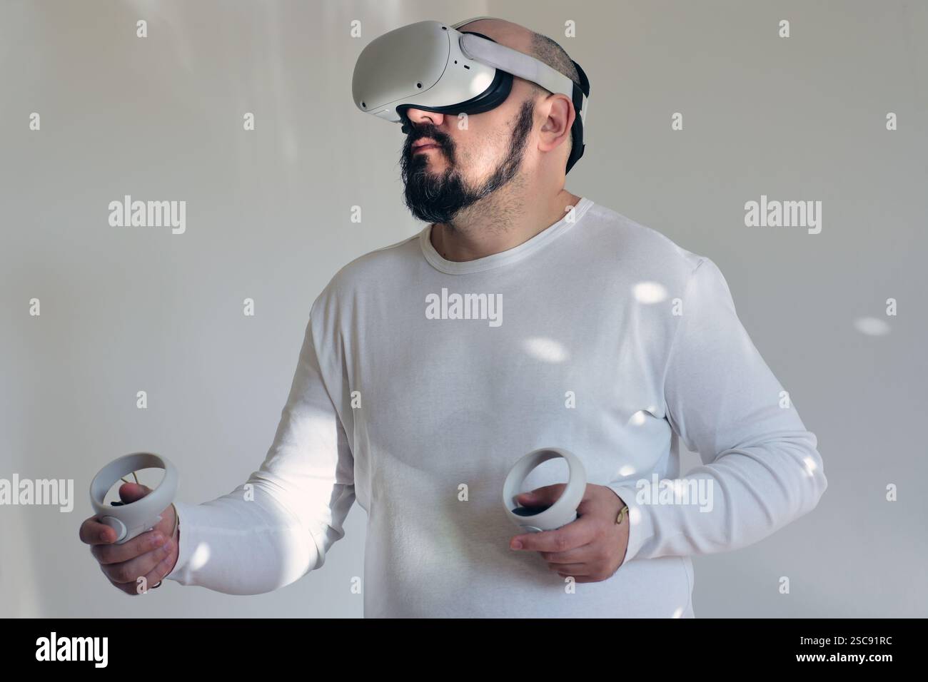 Man exploring in virtual reality headset Stock Photo