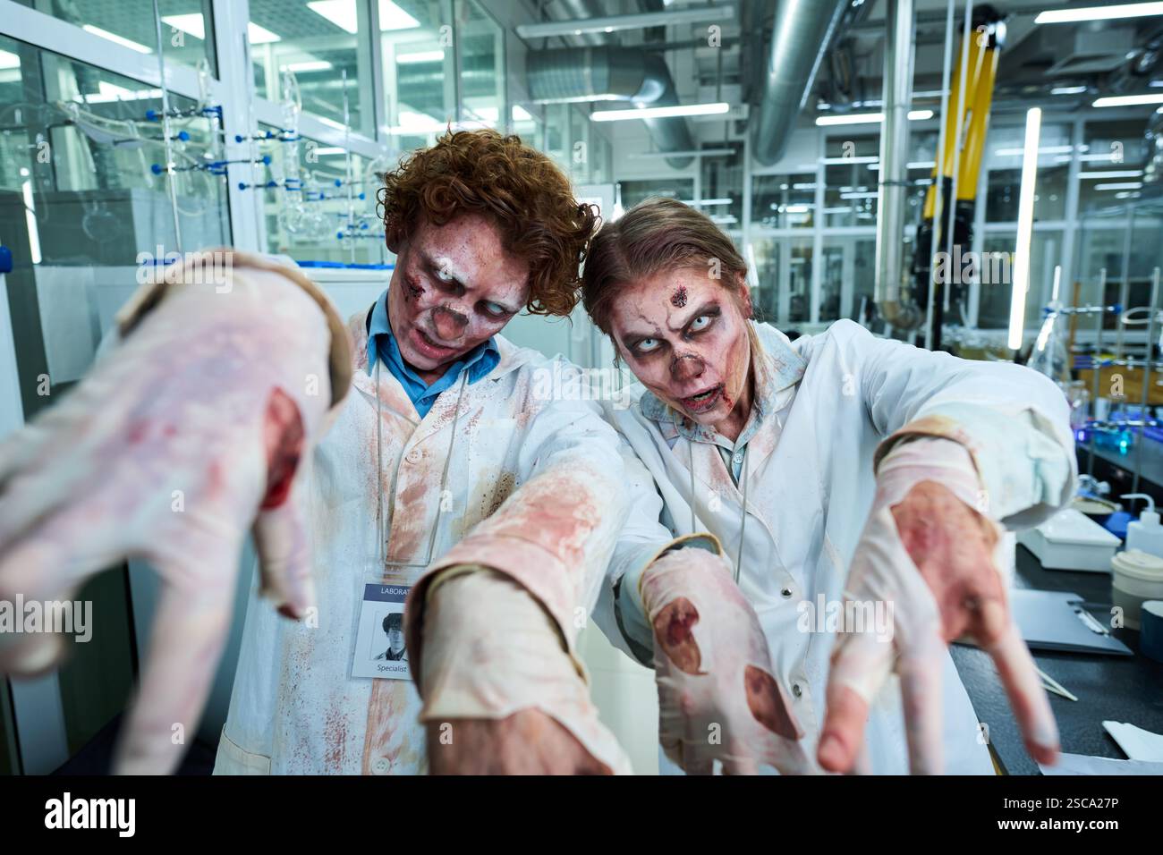 Zombie Lab Workers Reaching Out Hands Stock Photo