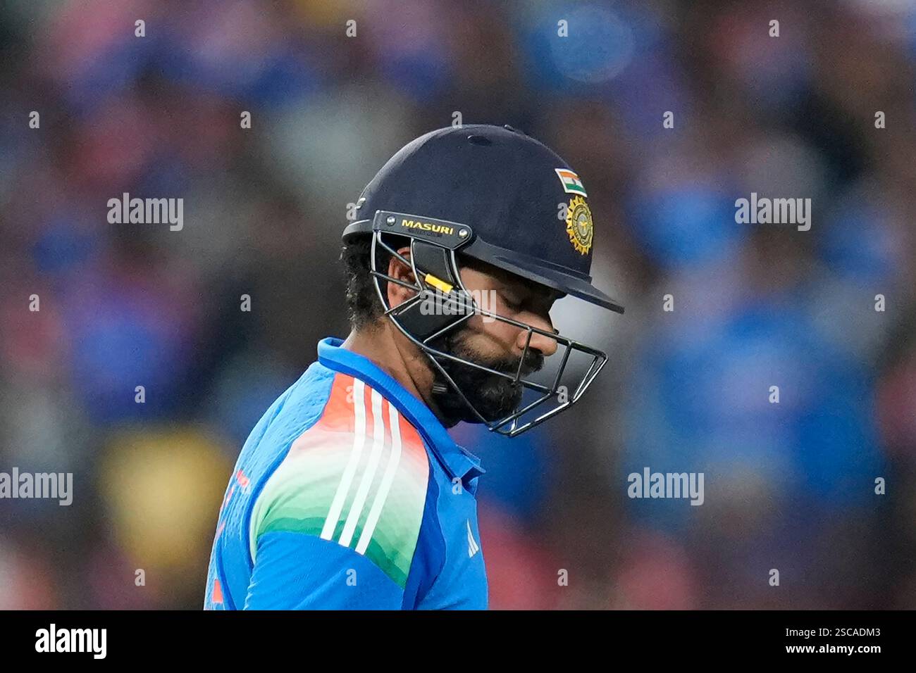 India's captain Rohit Sharma reacts as he walks off the field after ...