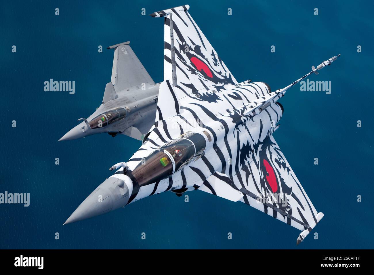 A French Air Force Dassault Rafale performing a sharp turn during an ...