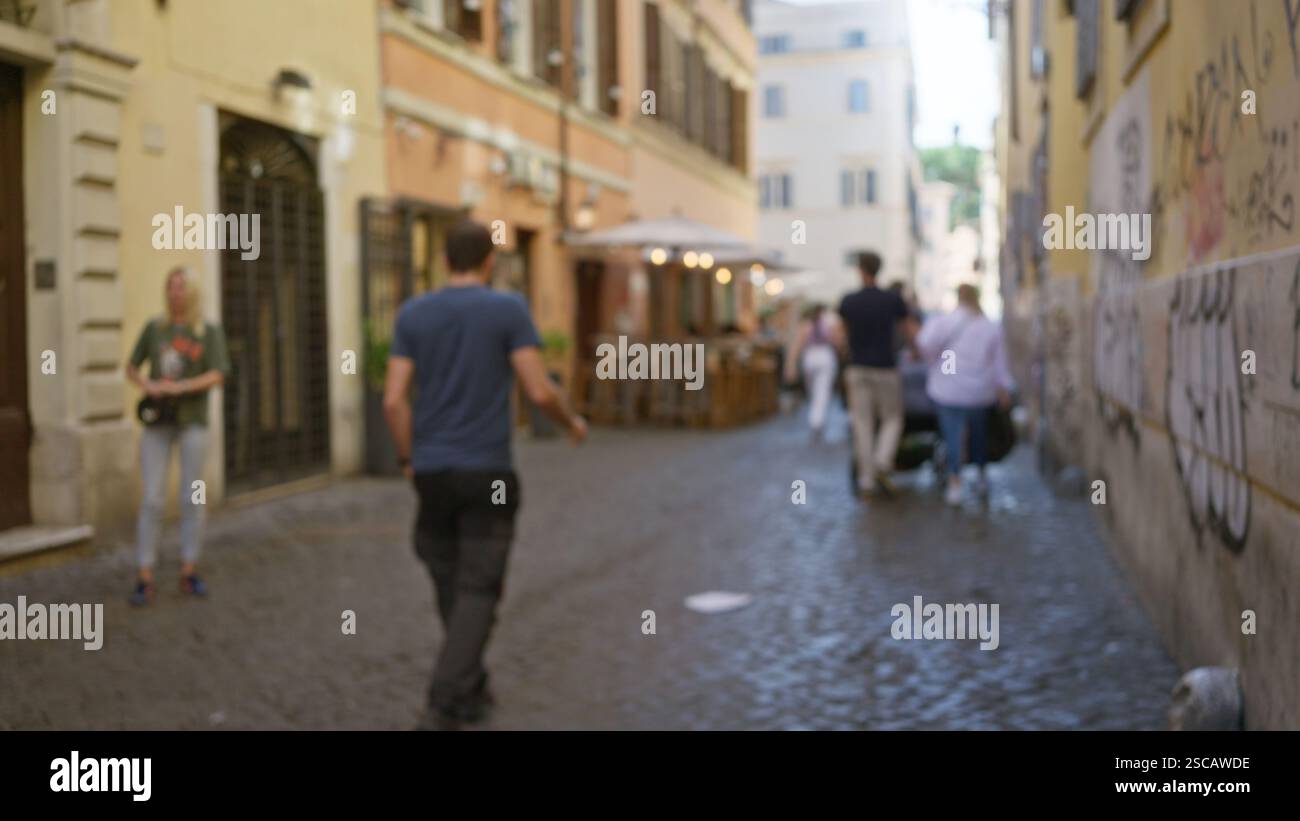 Blurred people strolling through a historic street in rome with outdoor ...