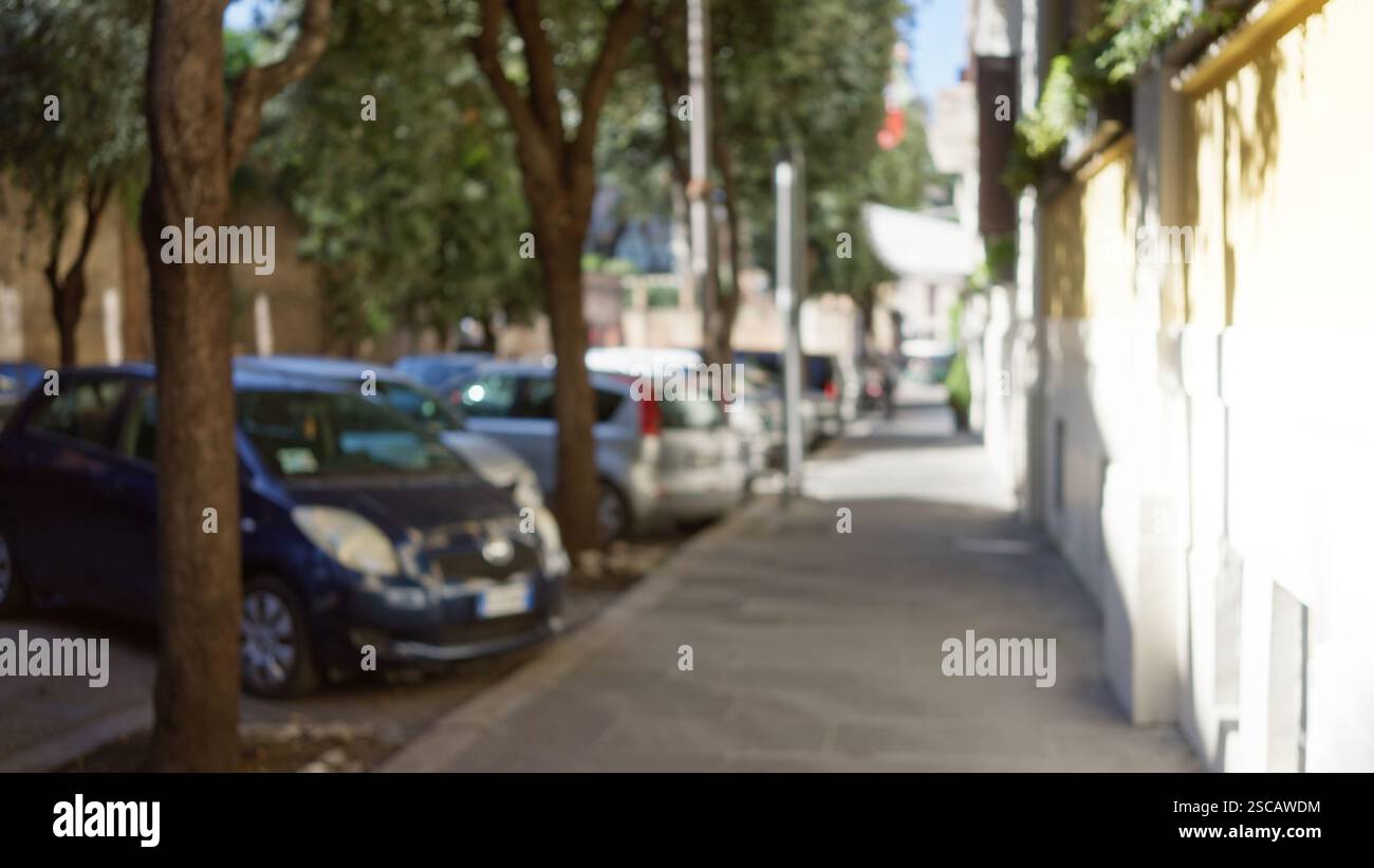 Blurred street scene in rome with cars, trees, and old buildings ...