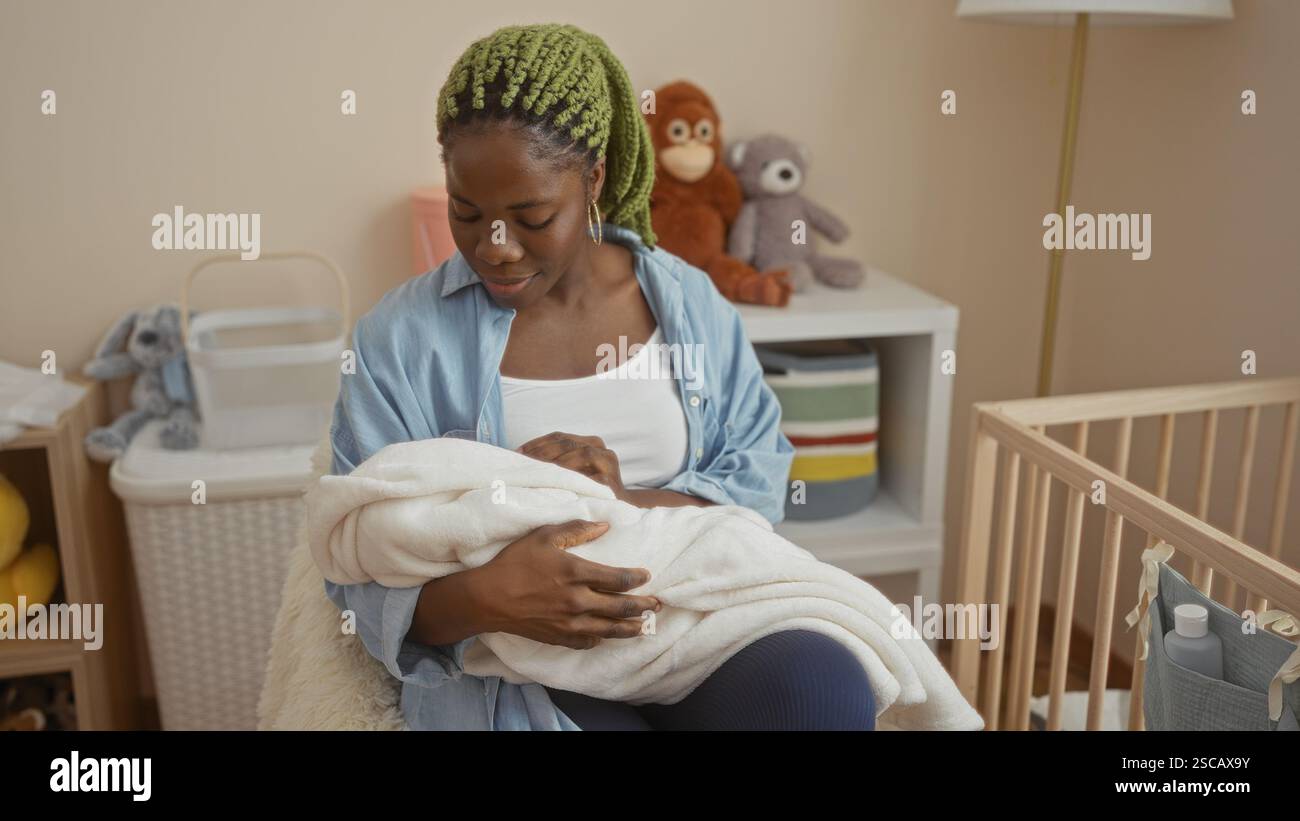 Woman with braids in a cozy bedroom cradling a baby, surrounded by soft ...