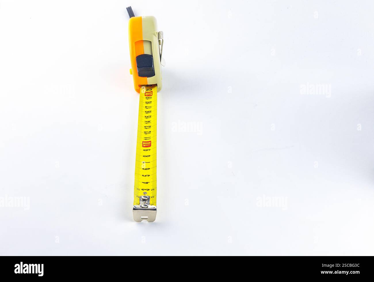 Metal construction tape measure, rolled measuring tape, tape measure on white background Stock Photo