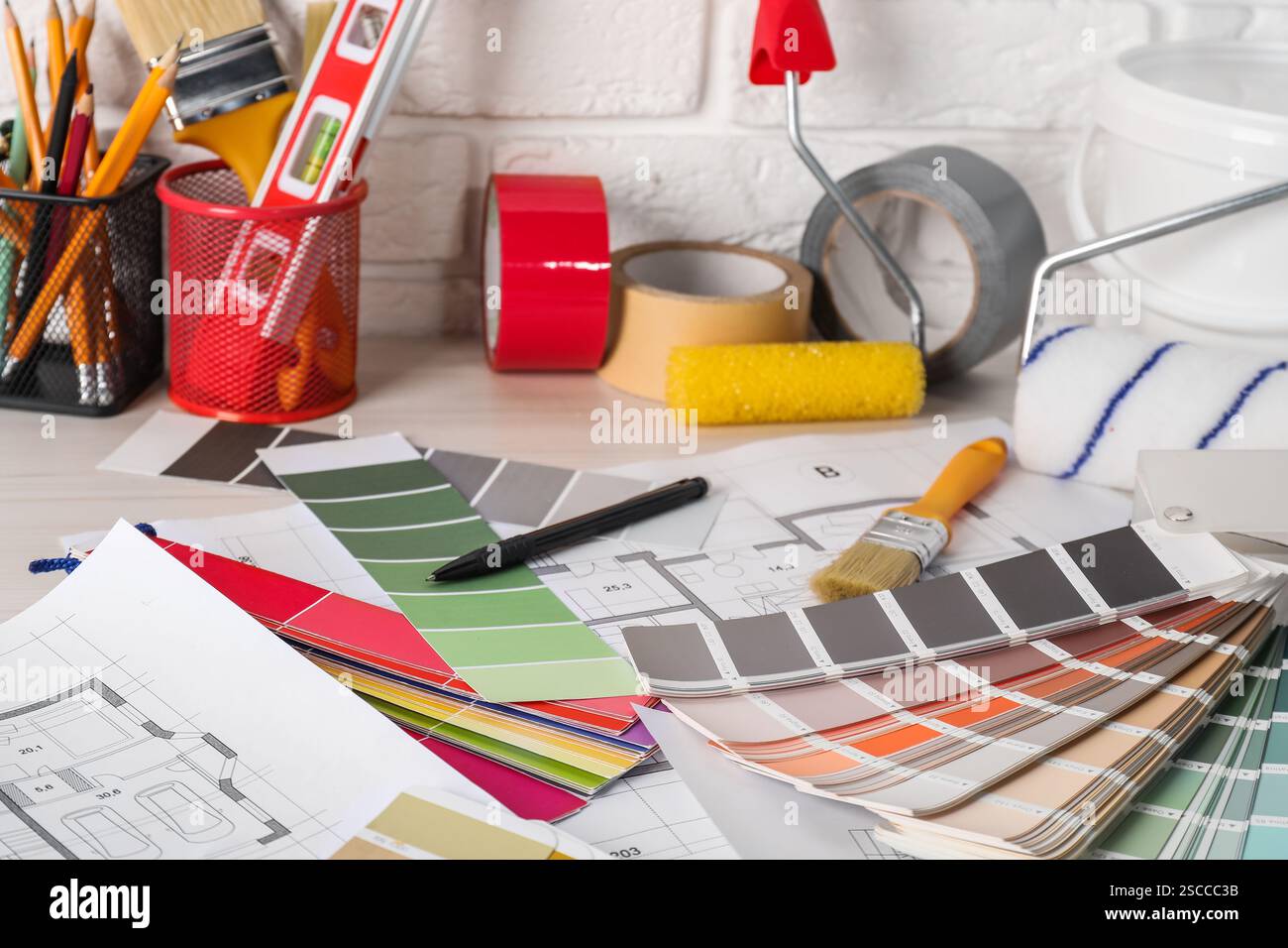 Different painter's tools on table. Decorating and design Stock Photo