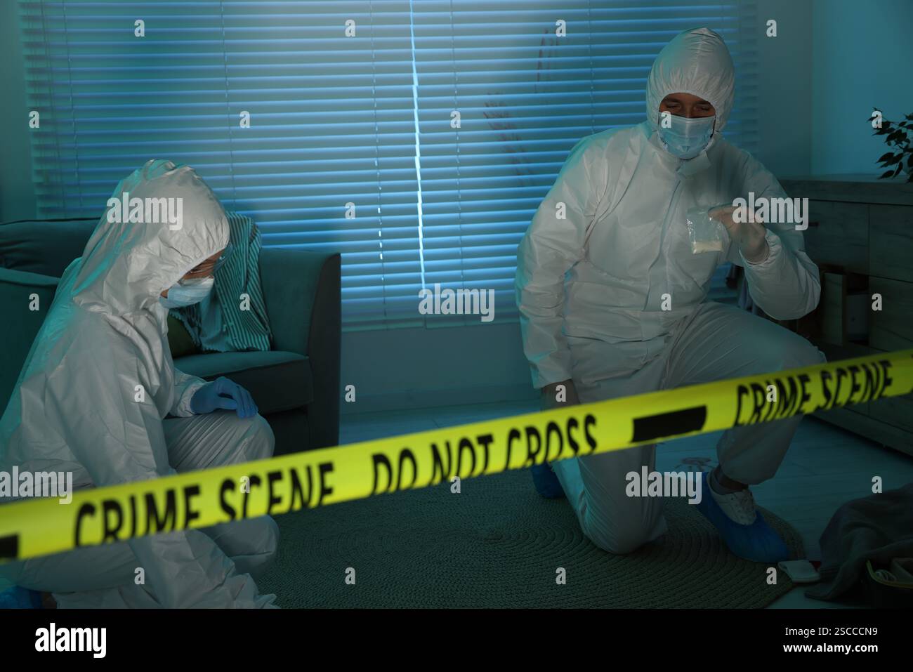 Forensic experts working at crime scene indoors Stock Photo - Alamy