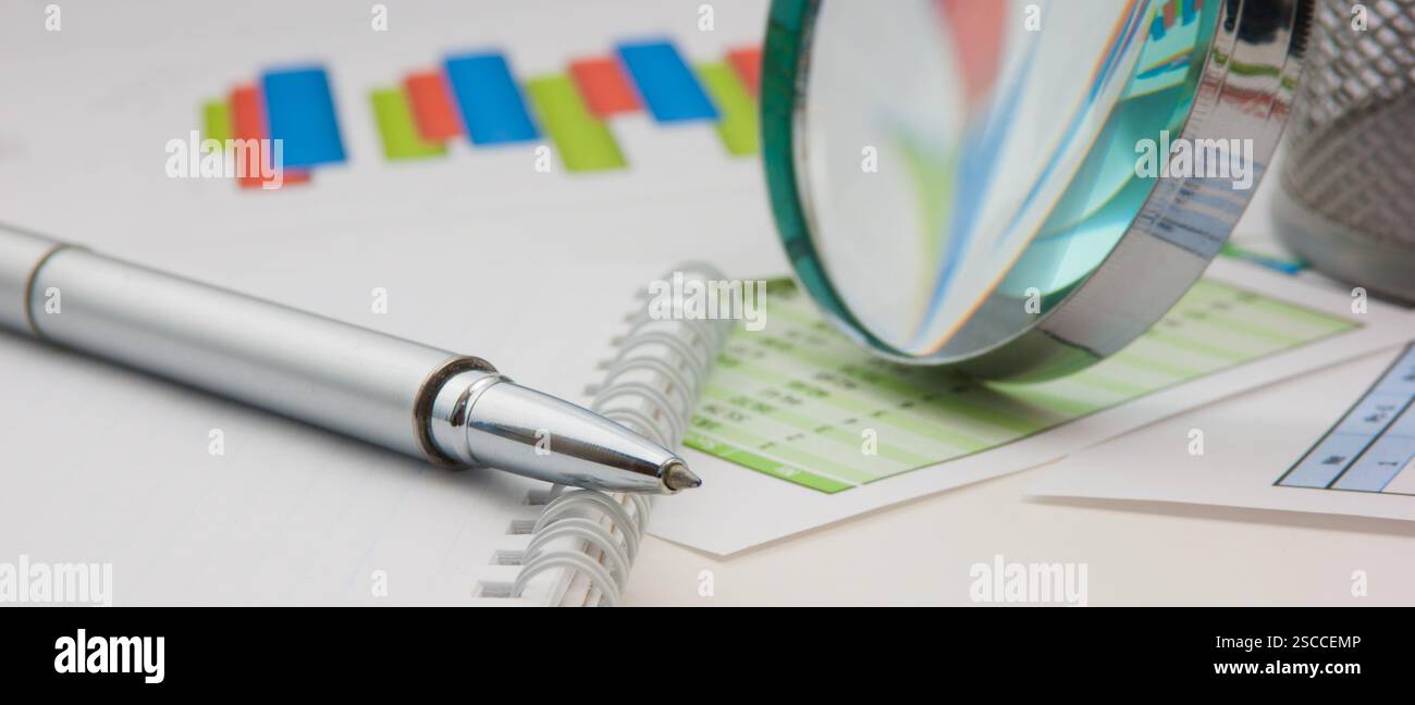 Graphs tables and documents laid on the table Stock Photo