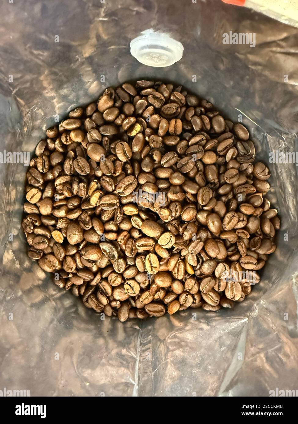 Heap of Coffee beans in package ready to use italian roast Stock Photo