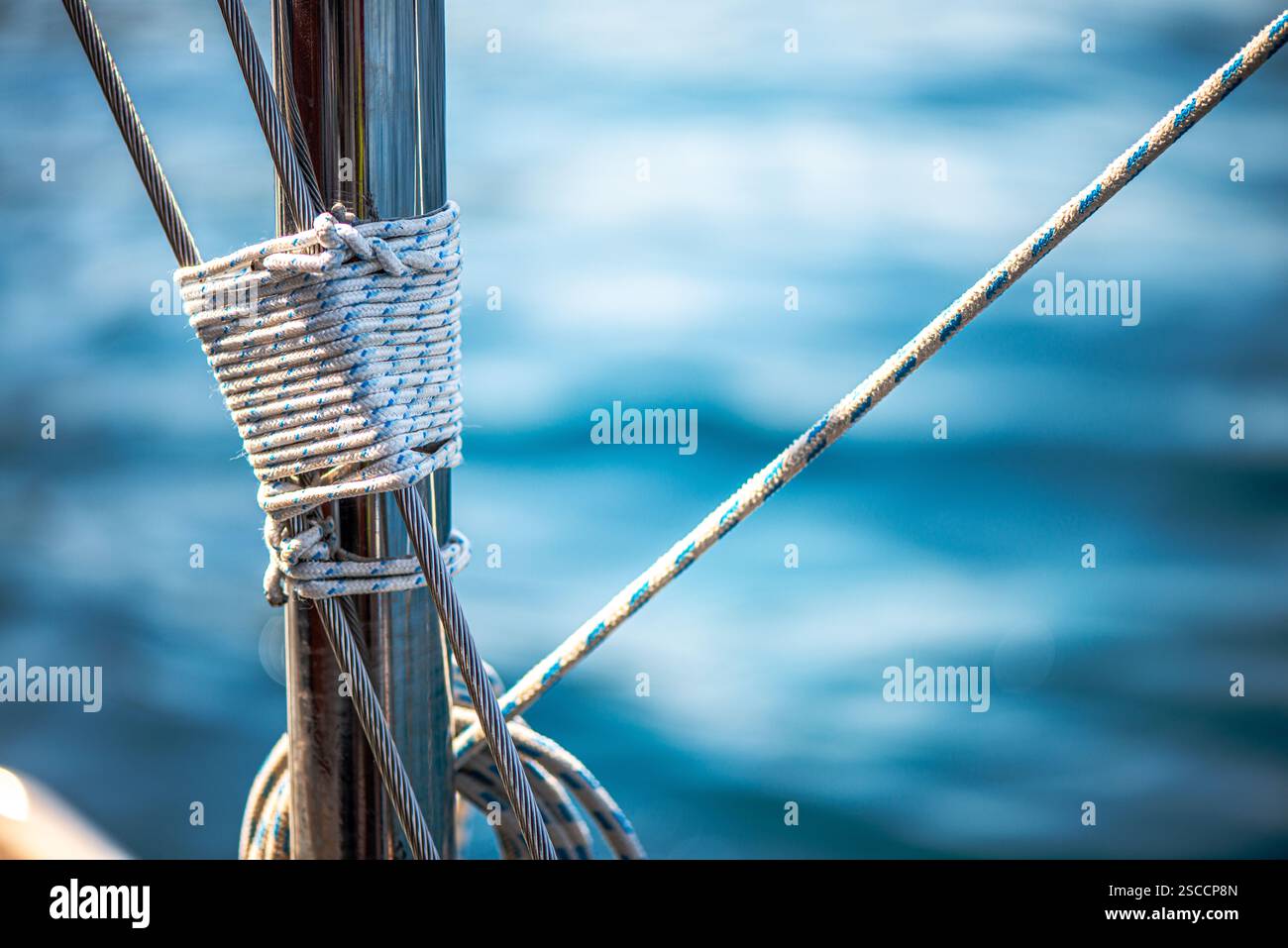 A detailed macro view of a ship’s rope and winch, capturing the ...