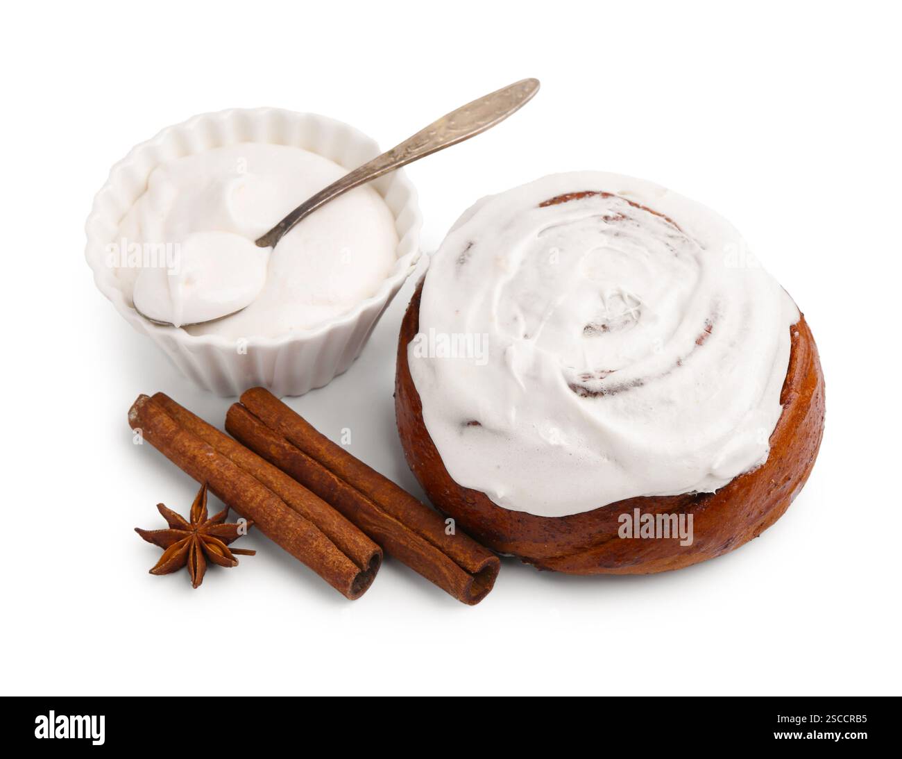 Tasty cinnamon roll with cream and spices isolated on white Stock Photo ...