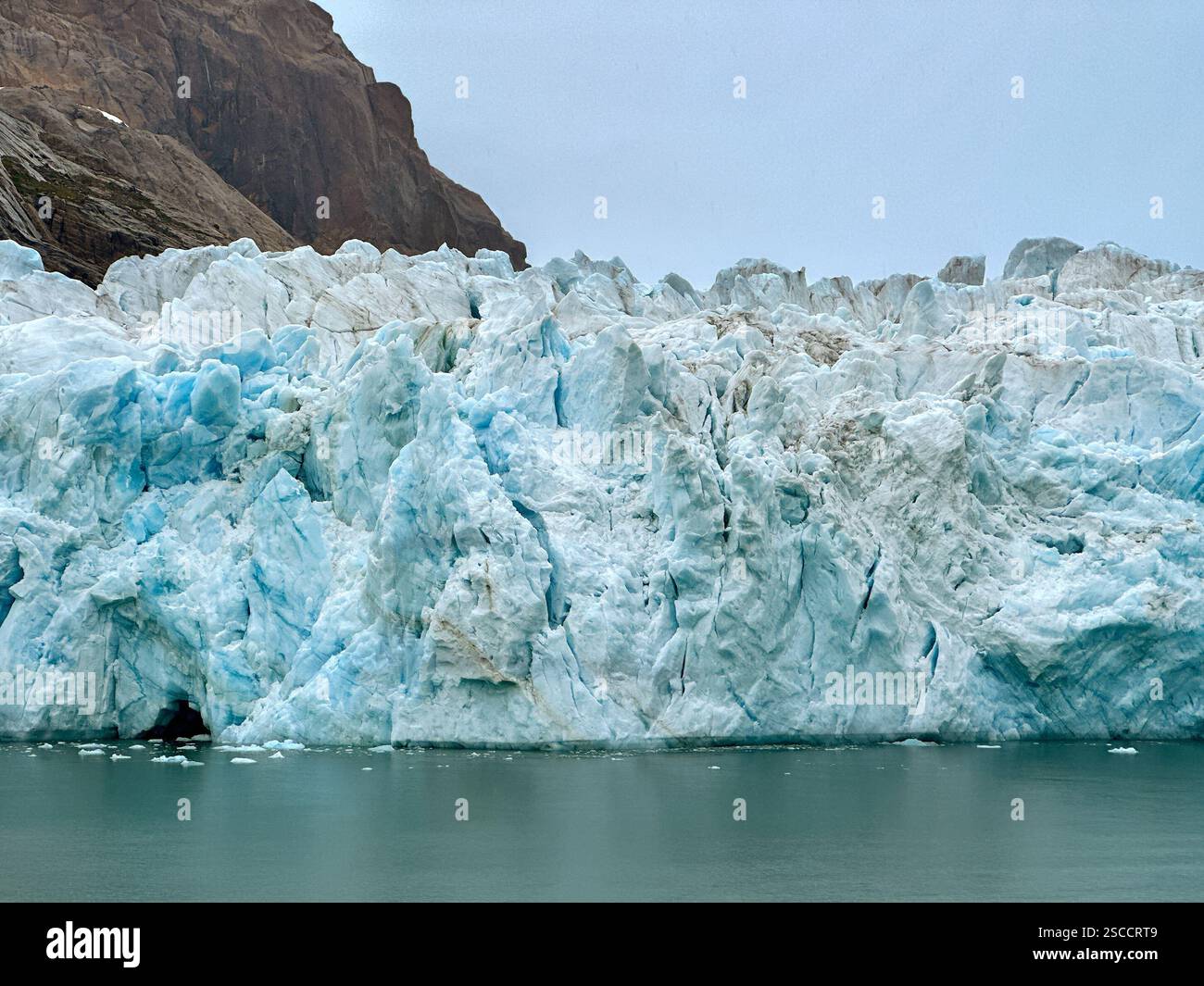 Large glacier meets the waters of a fjord in Prince Christian Sound in Greenland - Smartphone Captured Stock Image