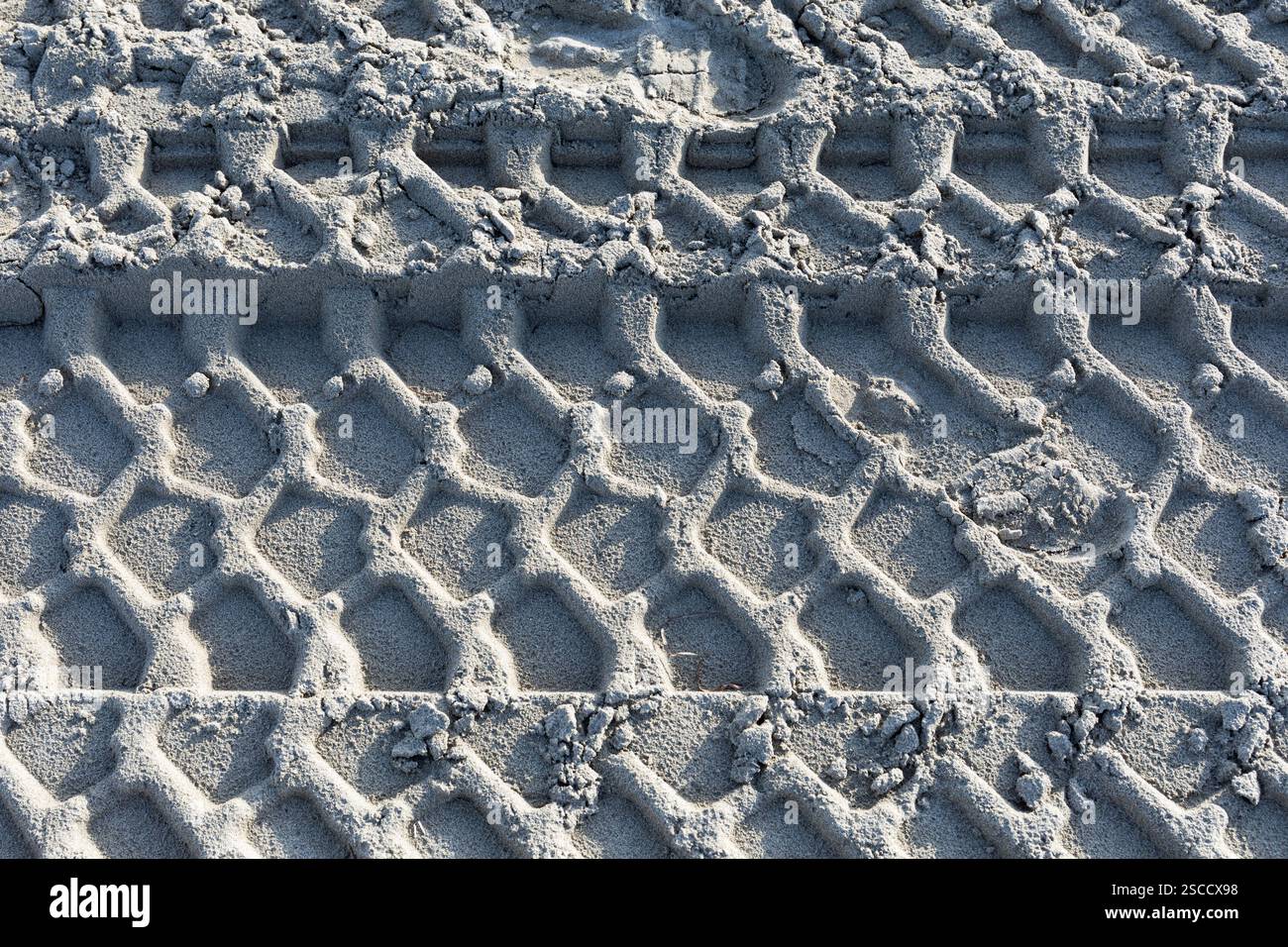 Tire tracks in the sand Stock Photo